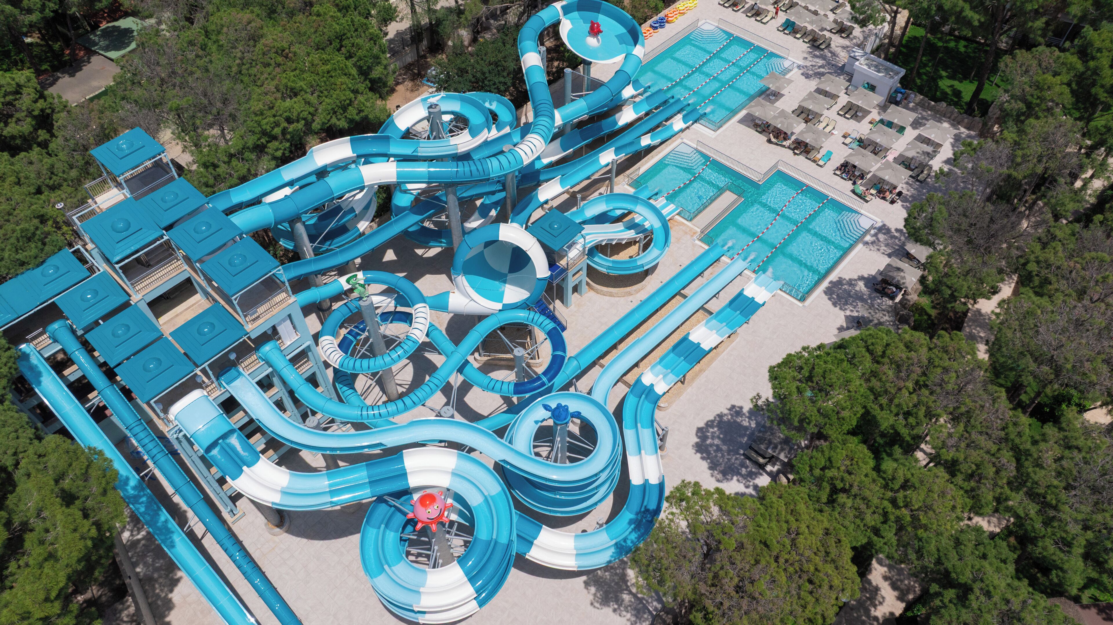 An aerial view of a water park with multiple slides and pools.