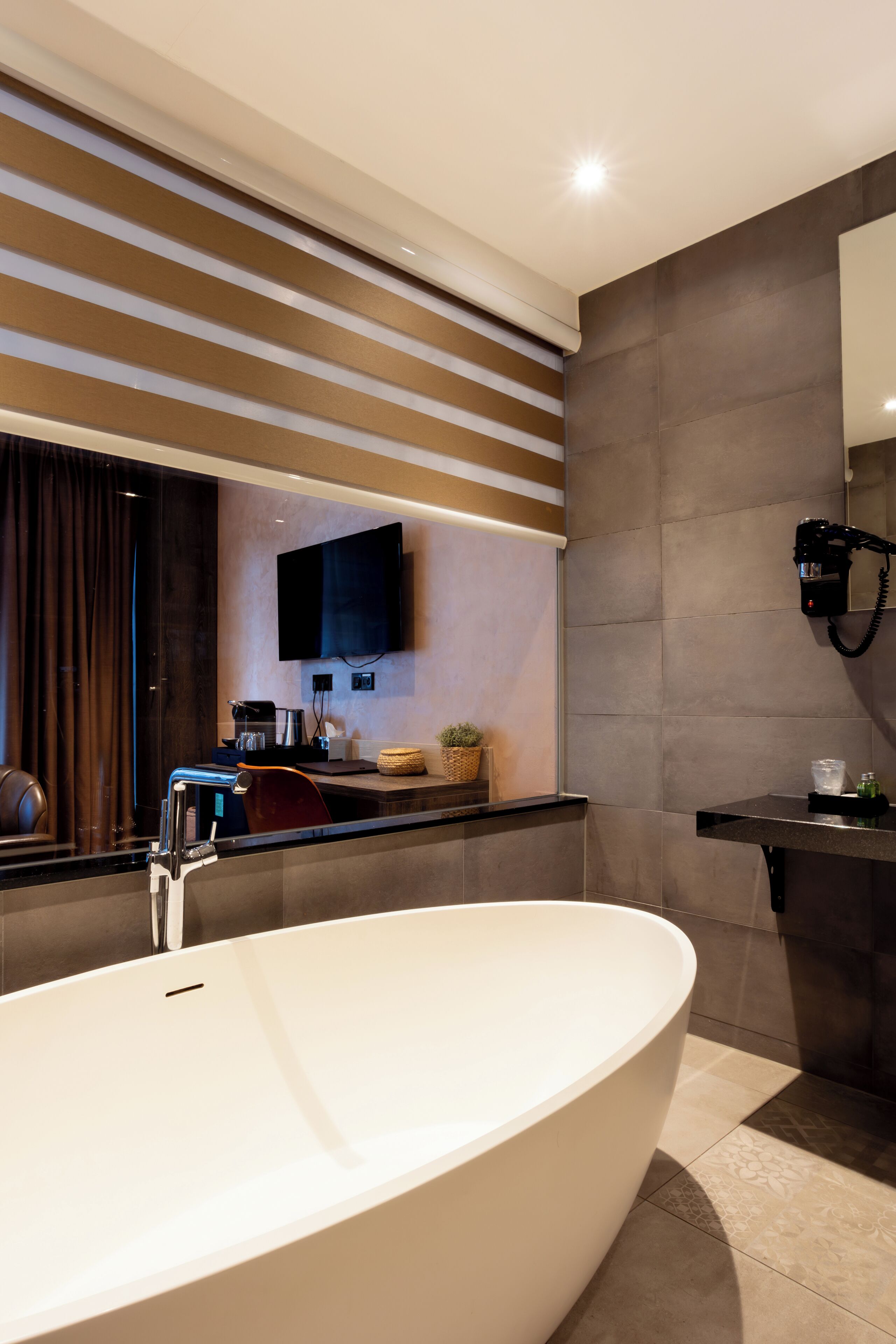 premier double room, 1 king bed | bathroom | free toiletries, hair dryer, towels