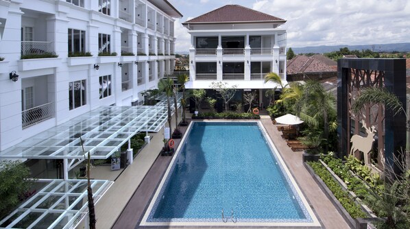 Outdoor pool, pool umbrellas, pool loungers