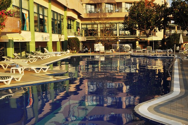 Indoor pool, outdoor pool, pool umbrellas, pool loungers