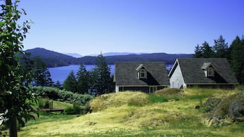 A house with a sloped roof, a small attic window, and a visible chimney.