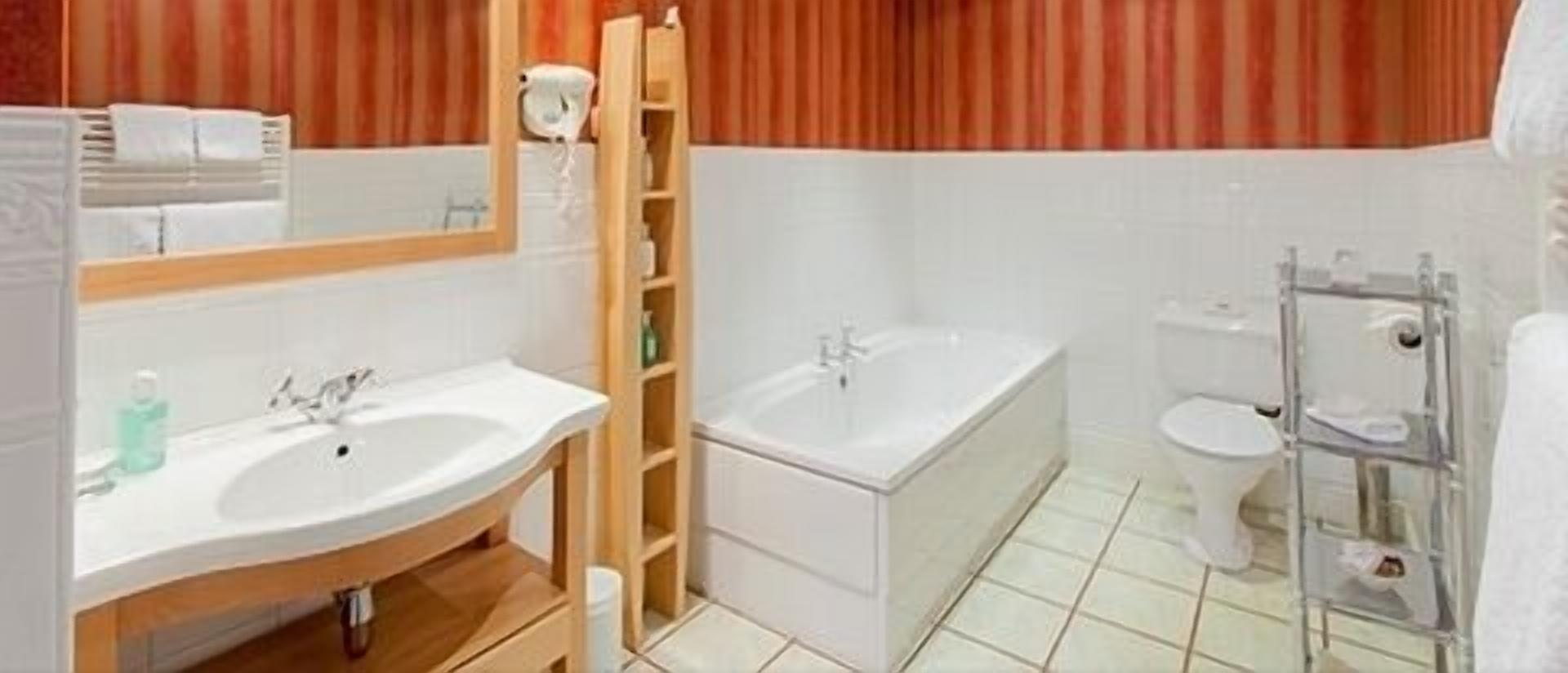 designer toiletries, hair dryer, bathrobes, towels