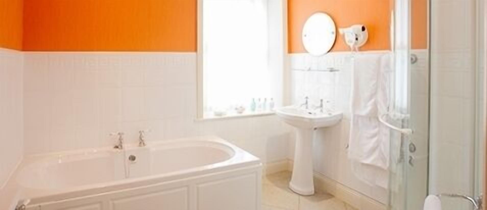 designer toiletries, hair dryer, bathrobes, towels