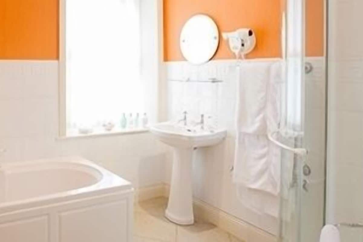 designer toiletries, hair dryer, bathrobes, towels