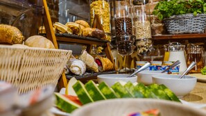 A breakfast buffet with various pastries, fruits, and condiments. - Five Stars Bed&Breakfast (Wroclaw)
