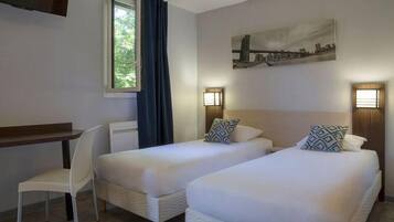 Premium bedding, desk, blackout drapes, iron/ironing board