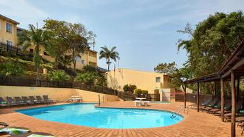 Outdoor pool, pool umbrellas, sun loungers