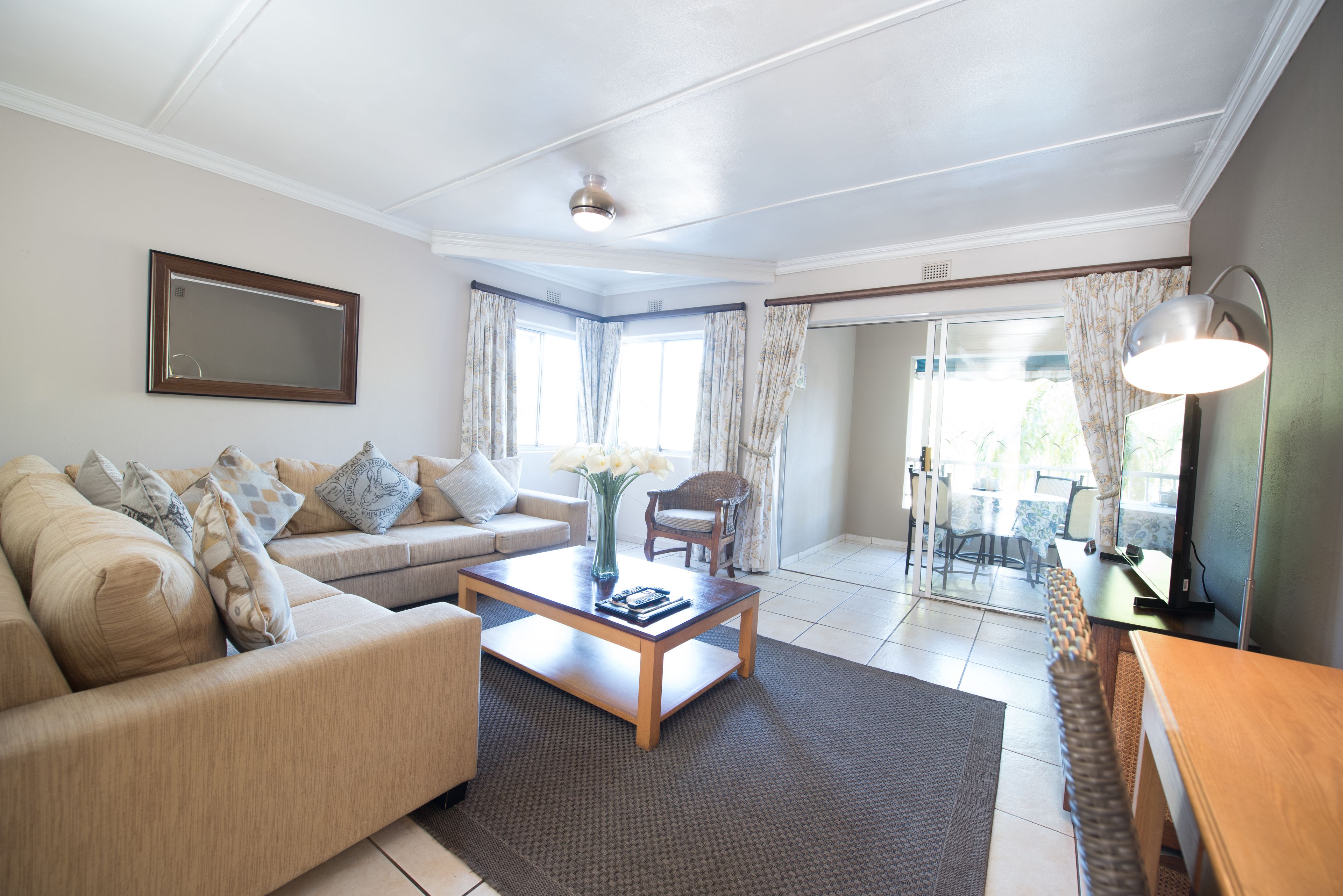 Apartment, 1 Bedroom | Living room | 49-inch flat-screen TV with satellite channels, TV, DVD player