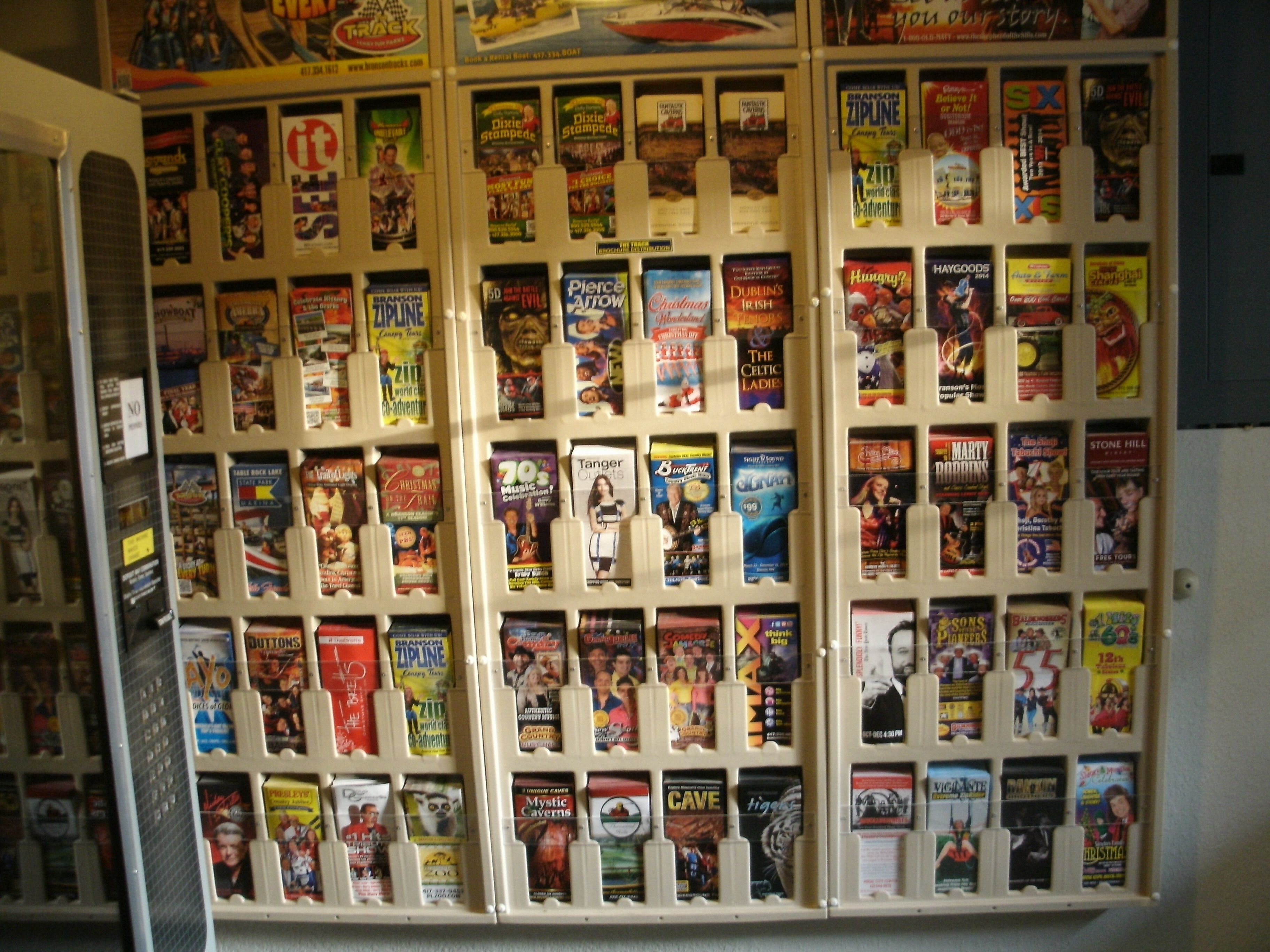 A display of various magazines and books in a store.
