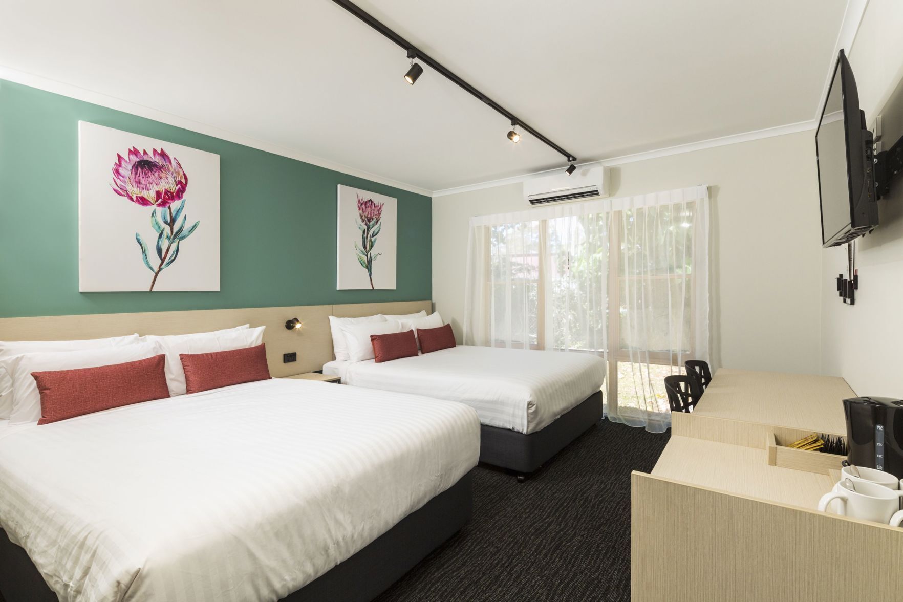 Desk, laptop workspace, iron/ironing board, free cots/infant beds