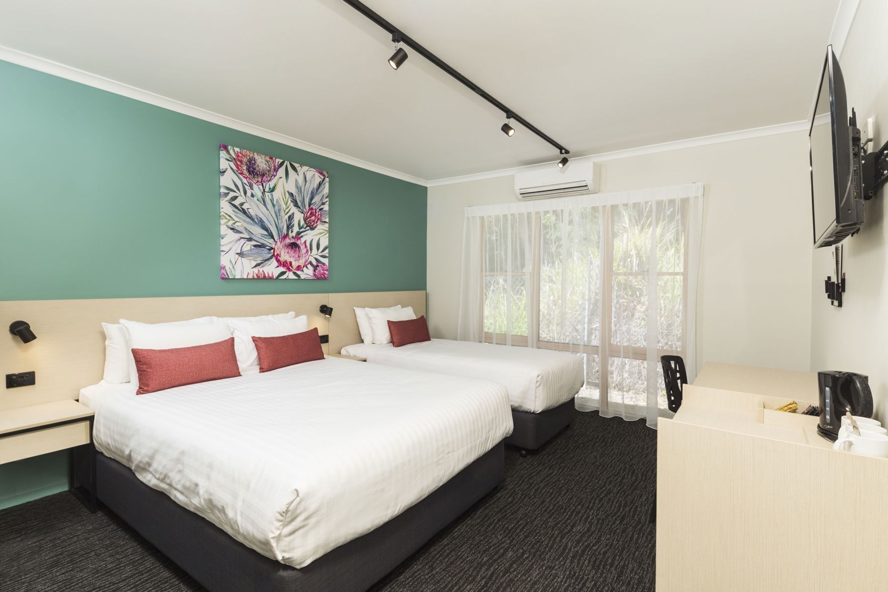 Desk, laptop workspace, iron/ironing board, free cots/infant beds