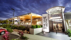 The Vale Hotel with Pokies Steakhouse signage, modern architecture, and a landscaped entrance. - Vale Hotel (Aitkenvale)