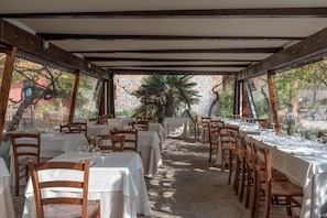 Breakfast, lunch, dinner served; Italian cuisine, garden views