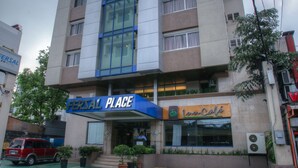 A multi-story hotel with a prominent 'FERSAL PLACE' sign. - Fersal Hotel Malakas (Quezon City)
