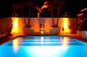 8 outdoor pools, a waterfall pool, pool umbrellas, pool loungers