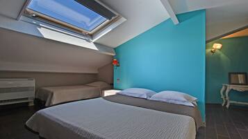 Standard Quadruple Room | Premium bedding, blackout drapes, cribs/infant beds, rollaway beds