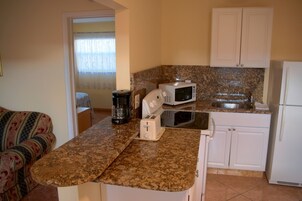 Apartment, 1 Bedroom | Private kitchen | Full-size fridge, microwave, coffee/tea maker