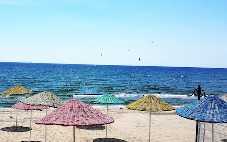 Private beach, sun loungers, beach umbrellas, beach volleyball