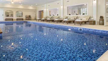 Indoor pool, open 8:00 AM to 10:00 PM, pool loungers