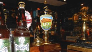 A bar with various beer bottles and taps, including brands like Fraoch and EPA. - The Kenbridge Hotel (Castle Douglas)