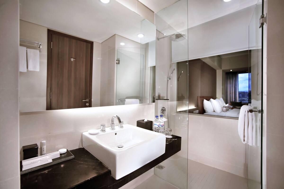 superior room | bathroom | shower, rainfall showerhead, free toiletries, slippers