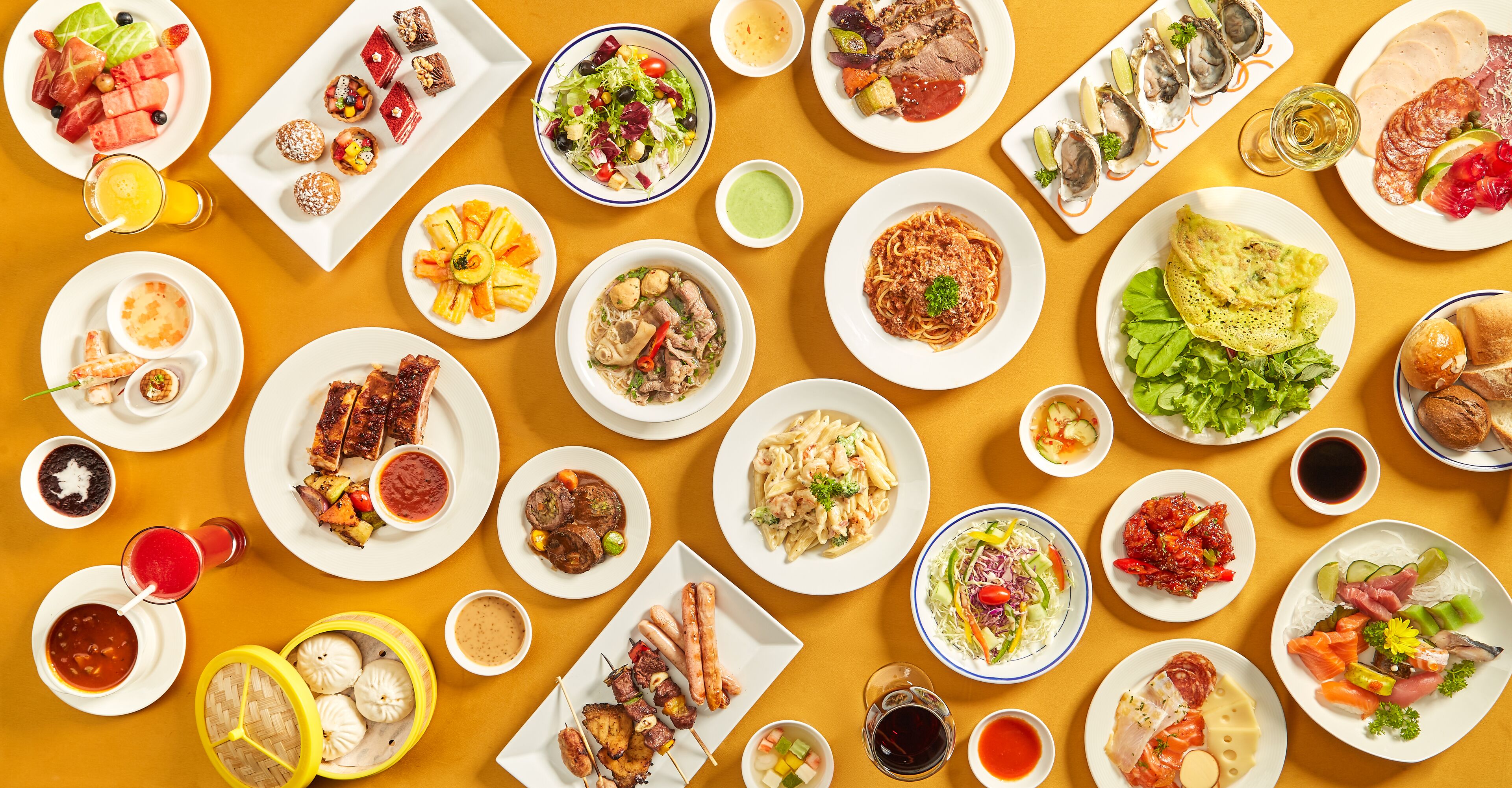 A variety of dishes and drinks arranged on a table.