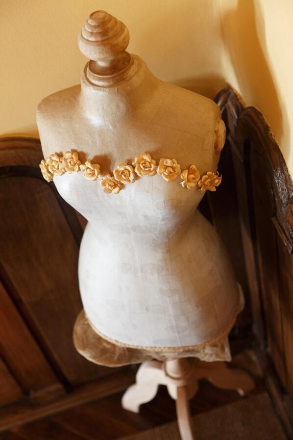 A mannequin with a dress featuring a floral pattern.