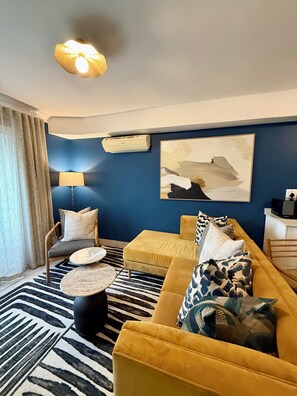 Standard Suite, 1 Bedroom | Living area | Flat-screen TV, DVD player