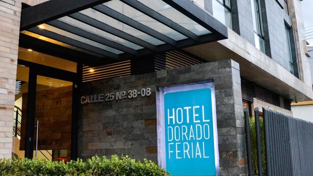 A hotel entrance with a sign reading "HOTEL DORADO FERIAL" and a visible address "CALLE 25 NO 38-08". - Hotel Dorado Ferial (Bogotá)