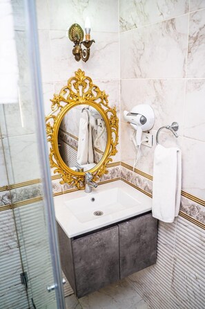 Shower, free toiletries, hair dryer, slippers