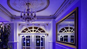 A grand entrance with a chandelier, double doors, and a large mirror. - Leyenda Hotel (Istanbul)