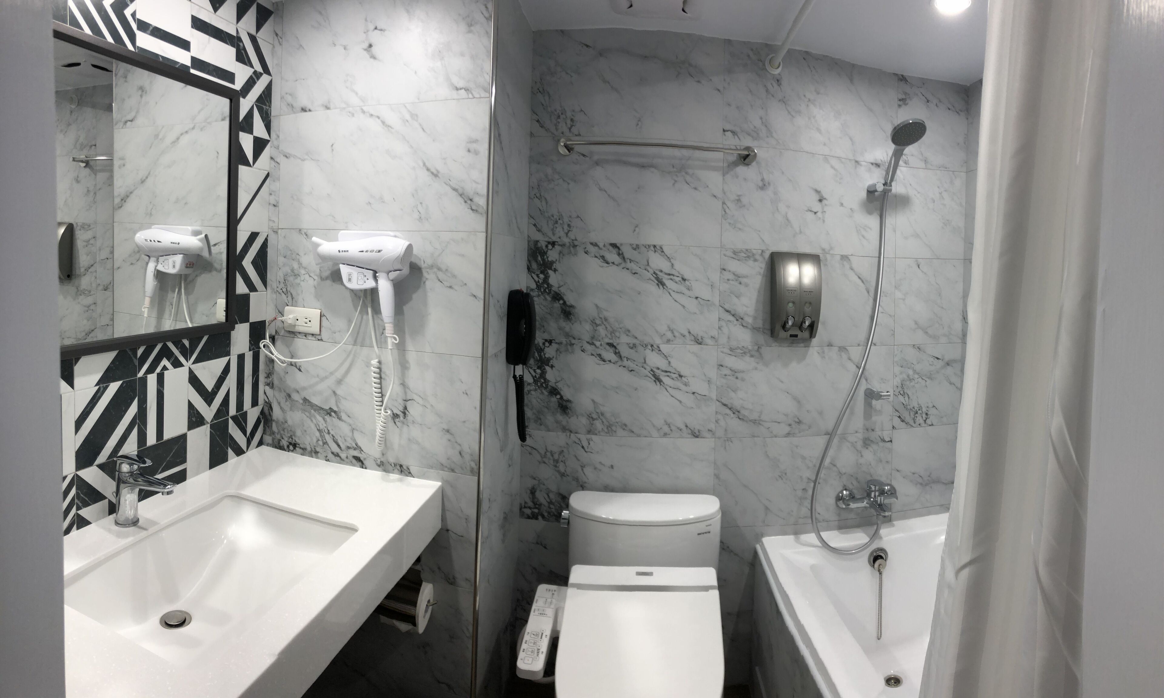 combined shower/bathtub, deep-soaking bathtub, hair dryer, slippers