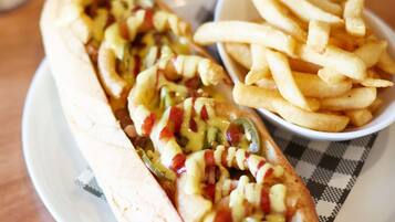 A plate with a hot dog and fries.