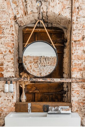 Suite, 1 King Bed | Bathroom | Rainfall showerhead, eco-friendly toiletries, hair dryer, slippers