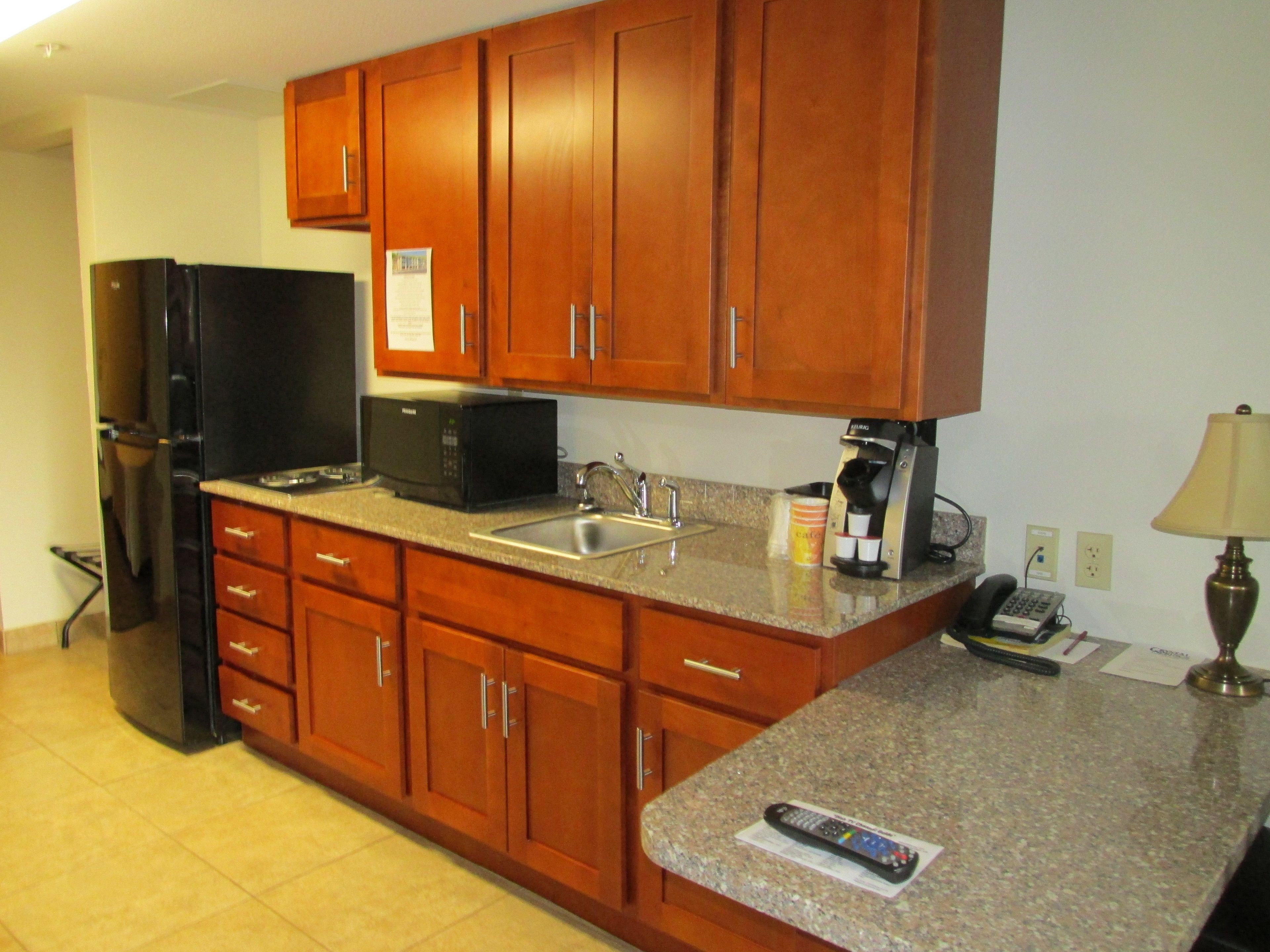 full-sized fridge, microwave, stovetop, coffee/tea maker