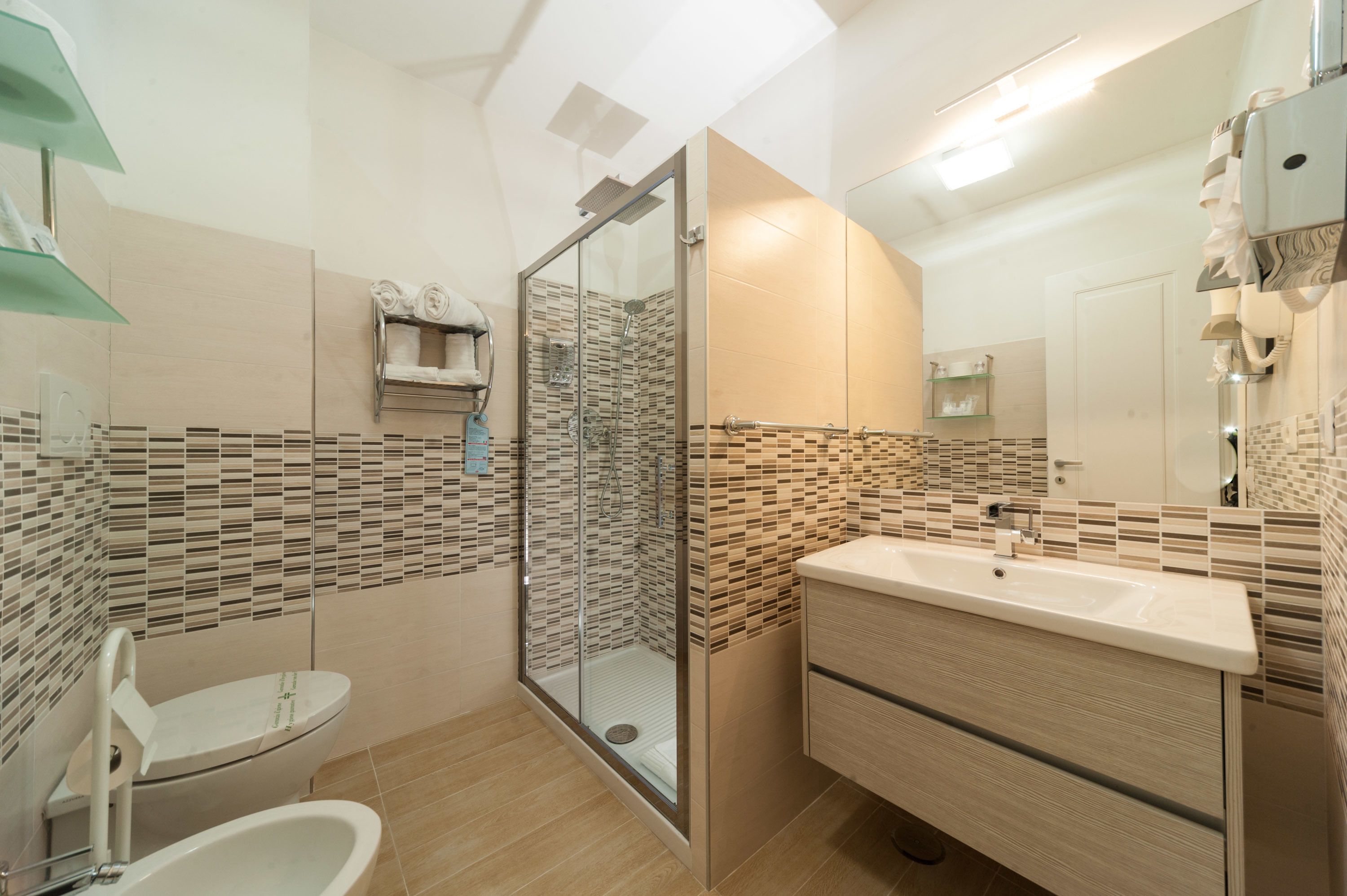 superior triple room, city view | bathroom | shower, rainfall showerhead, eco-friendly toiletries, hair dryer