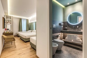 Deluxe Quadruple Room, City View | Bathroom | Shower, rainfall showerhead, eco-friendly toiletries, hair dryer - Relais Trevi 95 Boutique Hotel (Rome)