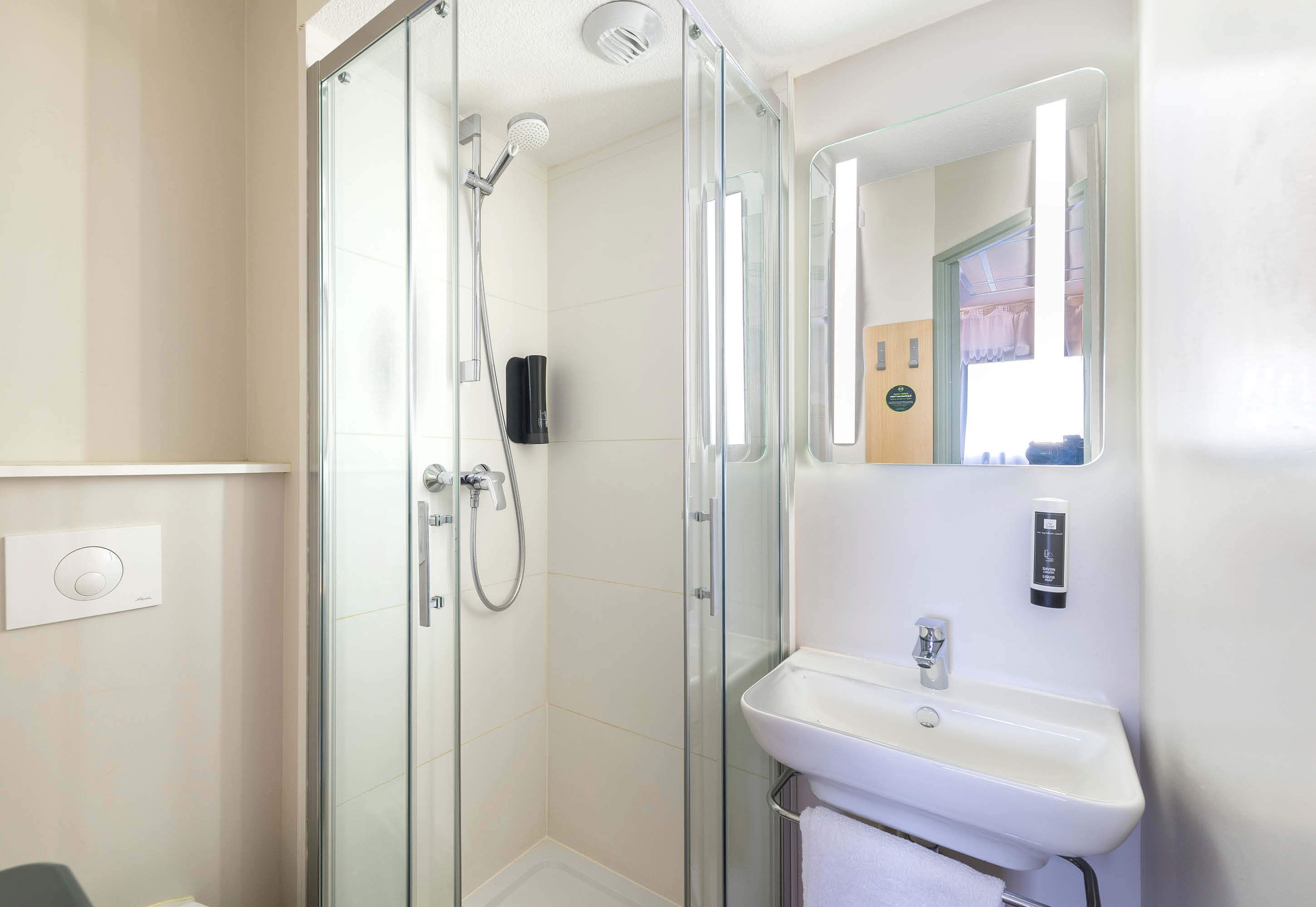 shower, free toiletries, hair dryer, towels