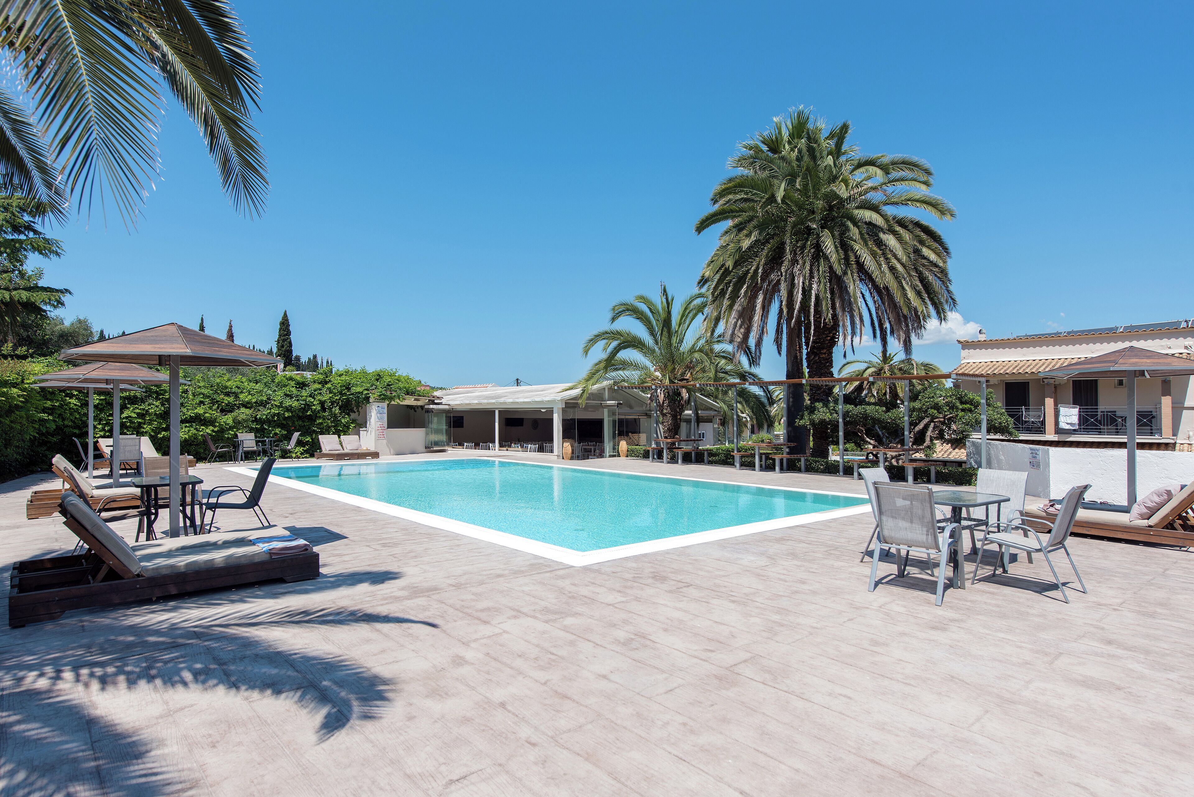 seasonal outdoor pool, pool umbrellas, pool loungers