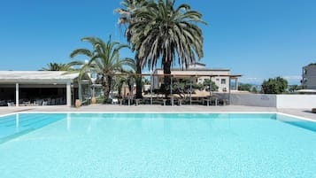 Seasonal outdoor pool, pool umbrellas, sun loungers