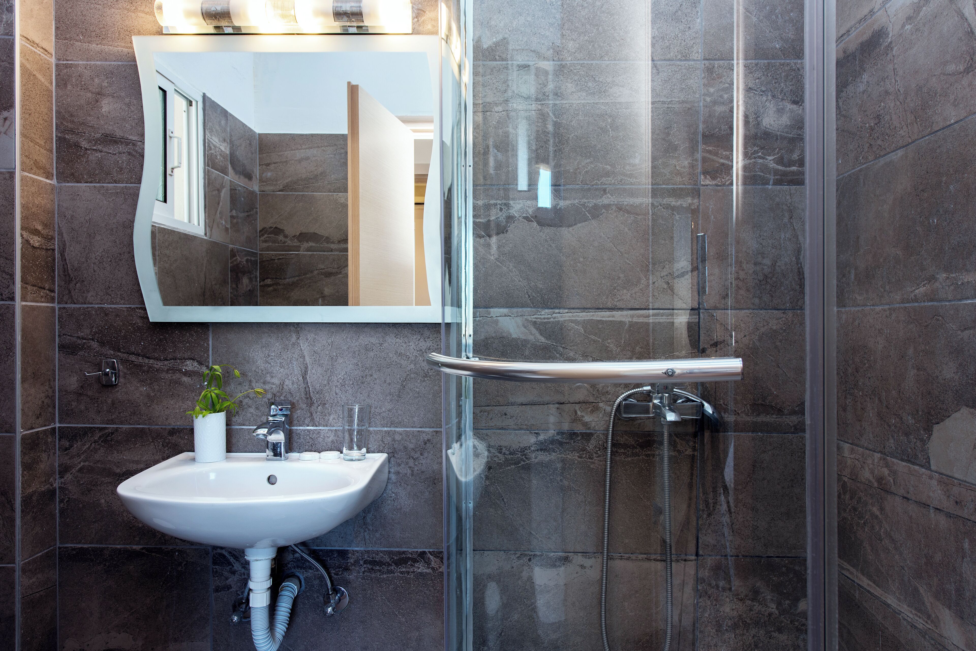 shower, hair dryer, towels, shampoo