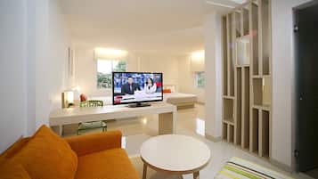 Family Quadruple Room | Living room | 32-inch TV with premium channels