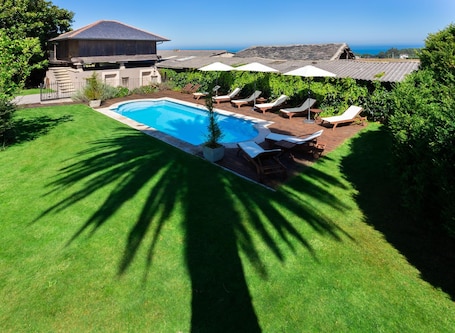 Outdoor pool, pool umbrellas, sun loungers