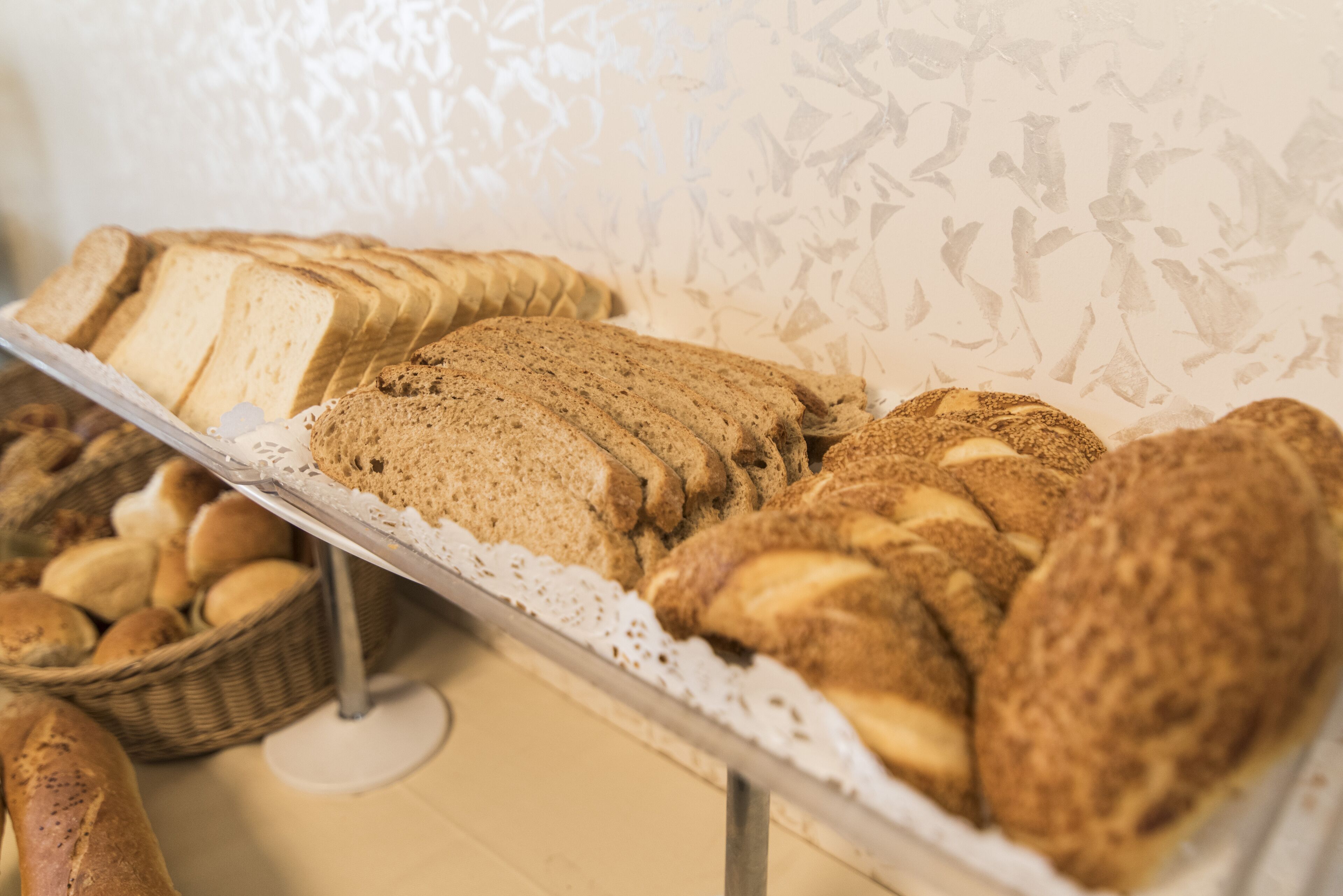 A display of various breads and pastries on a table.