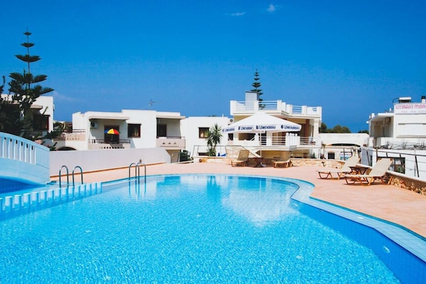 Seasonal outdoor pool, open 9:00 AM to 9:00 PM, pool umbrellas