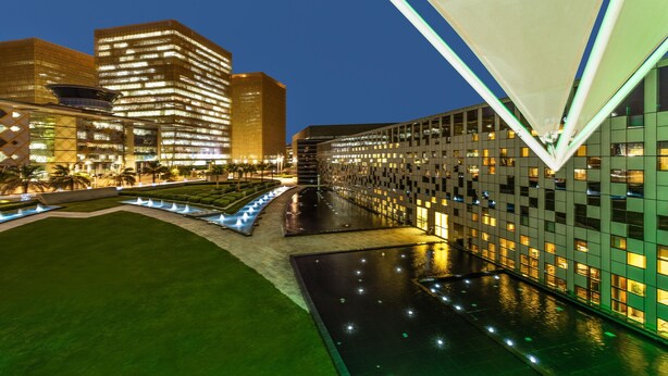 A modern hotel with a pool area, surrounded by high-rise buildings. - Crowne Plaza Riyadh RDC Hotel & Convention by IHG (Riyadh)