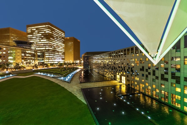 A modern hotel with a pool area, surrounded by high-rise buildings. - Crowne Plaza Riyadh RDC Hotel & Convention by IHG (Riyadh)