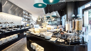 A modern kitchen with a central island, stainless steel appliances, and hanging pendant lights. - Mercure Pattaya Ocean Resort (Pattaya)