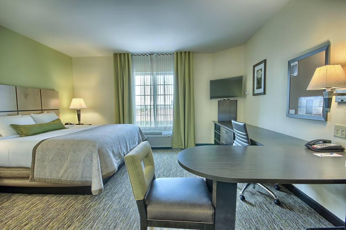 Desk, laptop workspace, blackout curtains, iron/ironing board