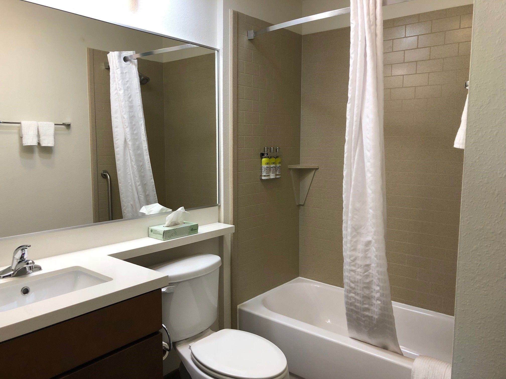 studio suite, 1 queen bed | bathroom | combined shower/bathtub, hair dryer, towels